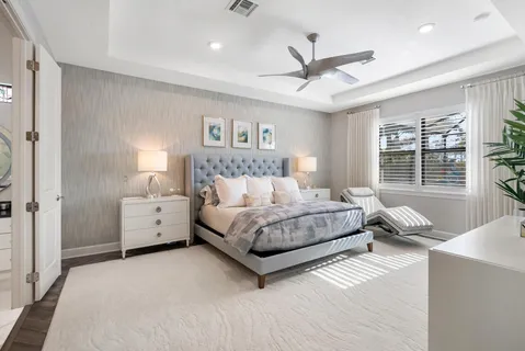 a spacious bedroom with a bed and a window