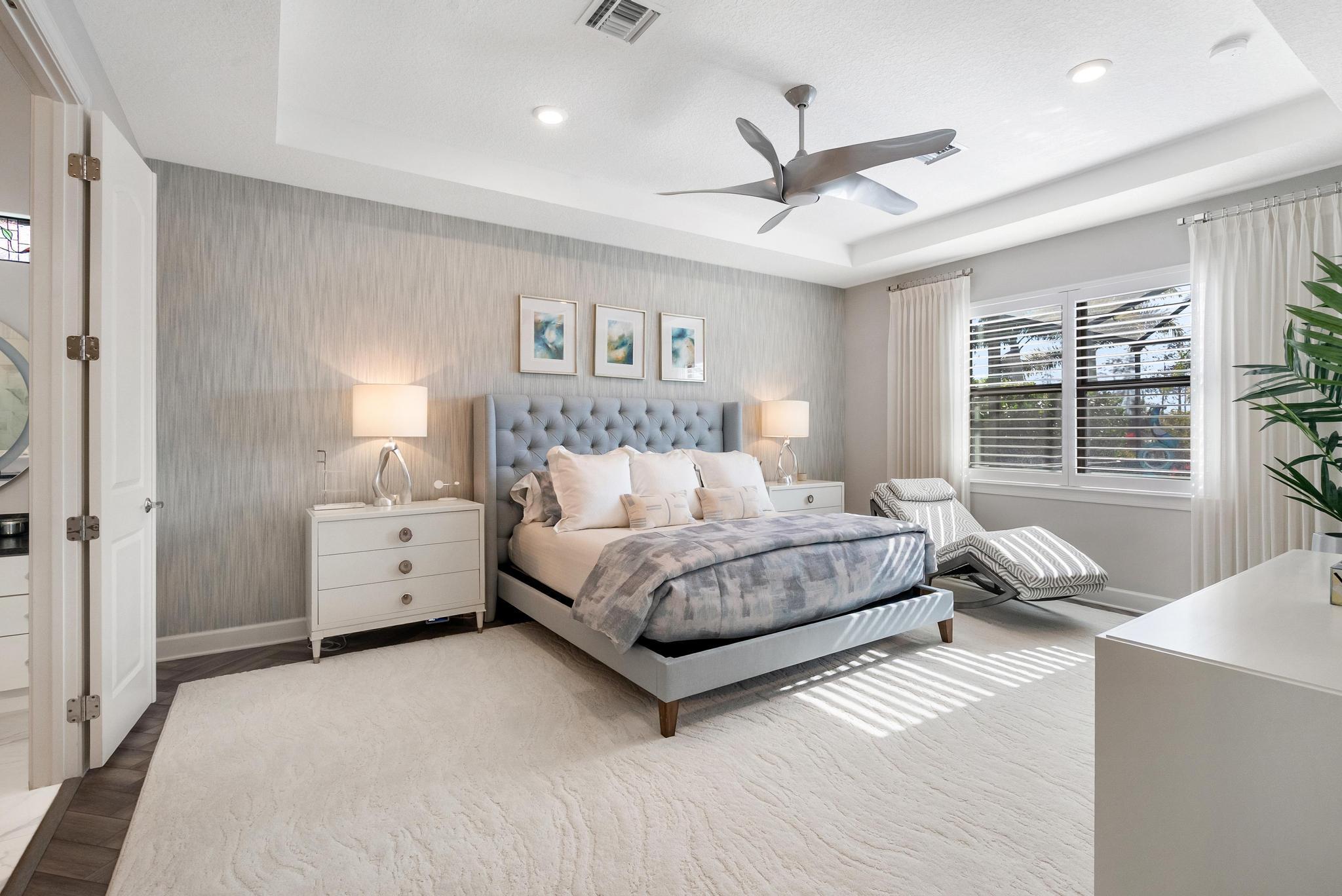 137 Cinder Dunes Point Jupiter, FL 33478 - Photo 10 of 45 a spacious bedroom with a bed and a window