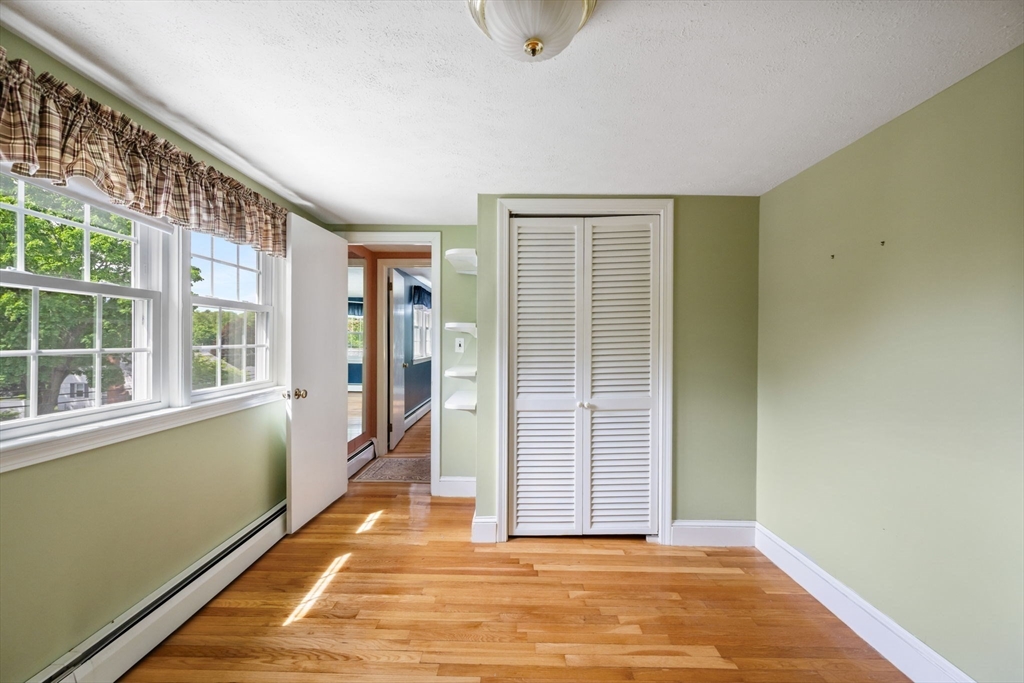 40 Bell Road Weymouth, MA 02188 - Photo 33 of 41 a view of a room with an empty space and wooden floor