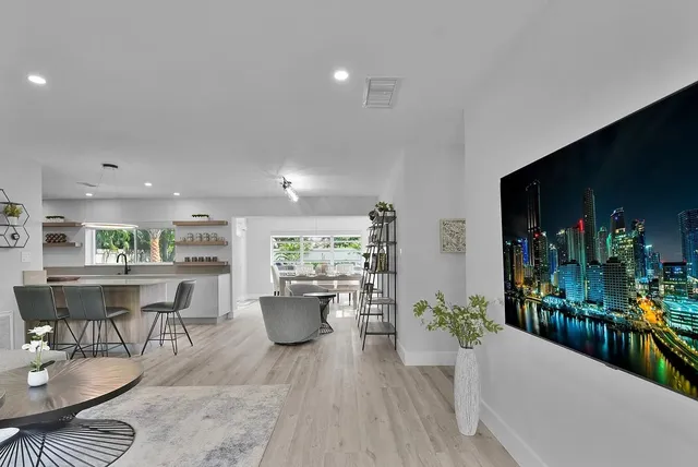 a living room with furniture and a potted plant