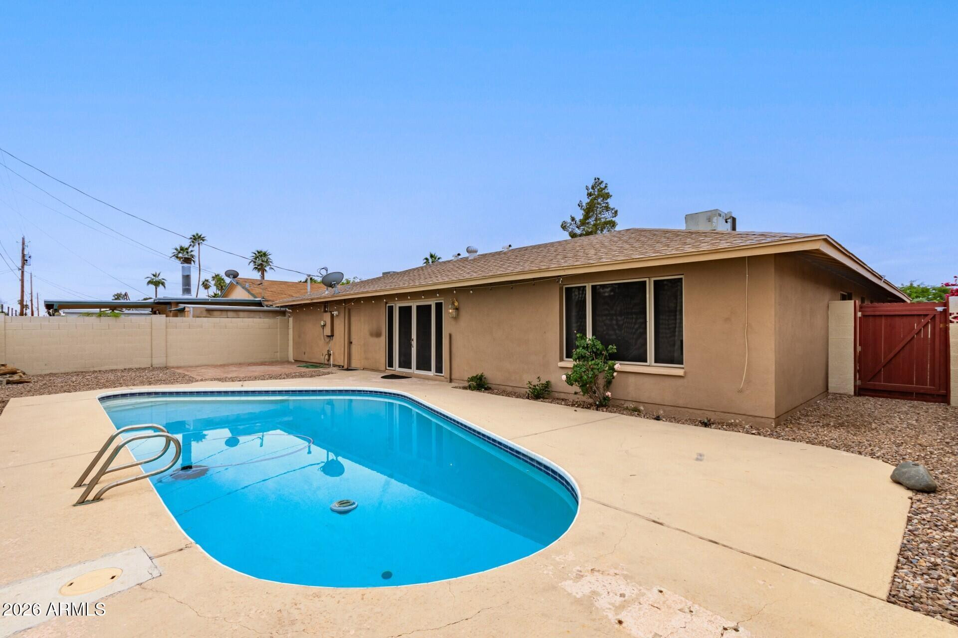 3613 South Kenneth Place Tempe, AZ 85282 - Photo 15 of 17 a view of a house with pool