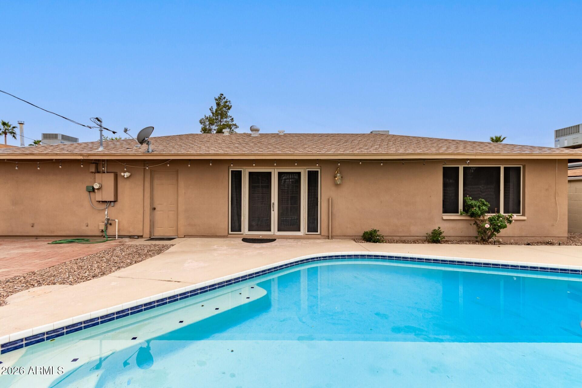 3613 South Kenneth Place Tempe, AZ 85282 - Photo 16 of 17 a front view of a house with a yard