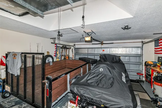 a bedroom with a bed and a potted plant