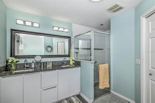 a bedroom with a bed and dresser