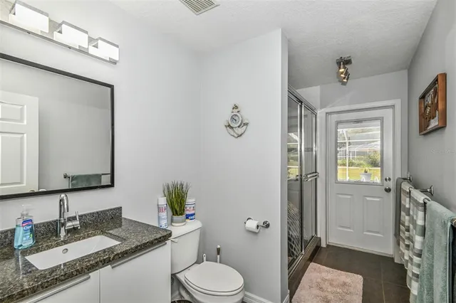 a view of a swimming pool with a patio