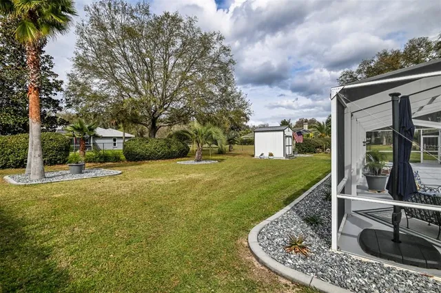 a front view of house with yard and outdoor seating
