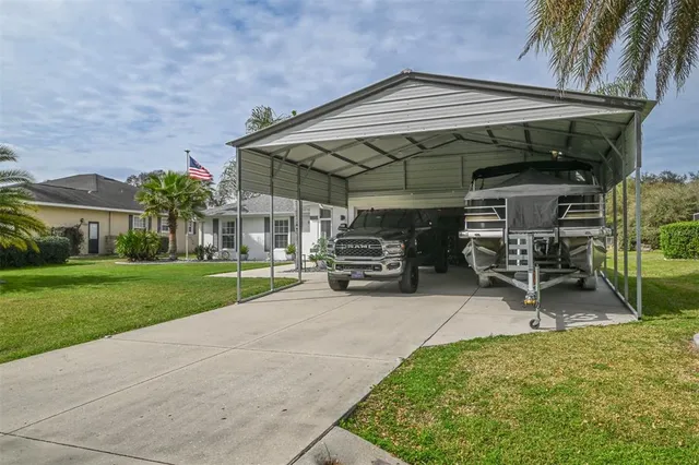 an aerial view of a house with a swimming pool