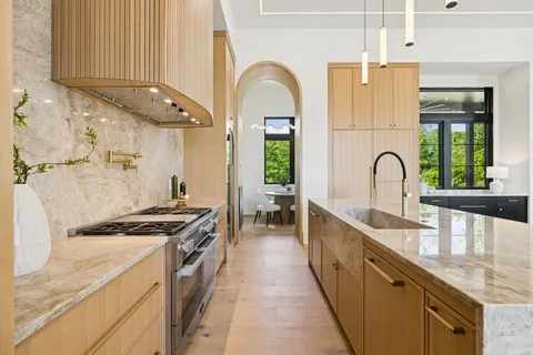 a kitchen with stainless steel appliances cabinets and a counter top space