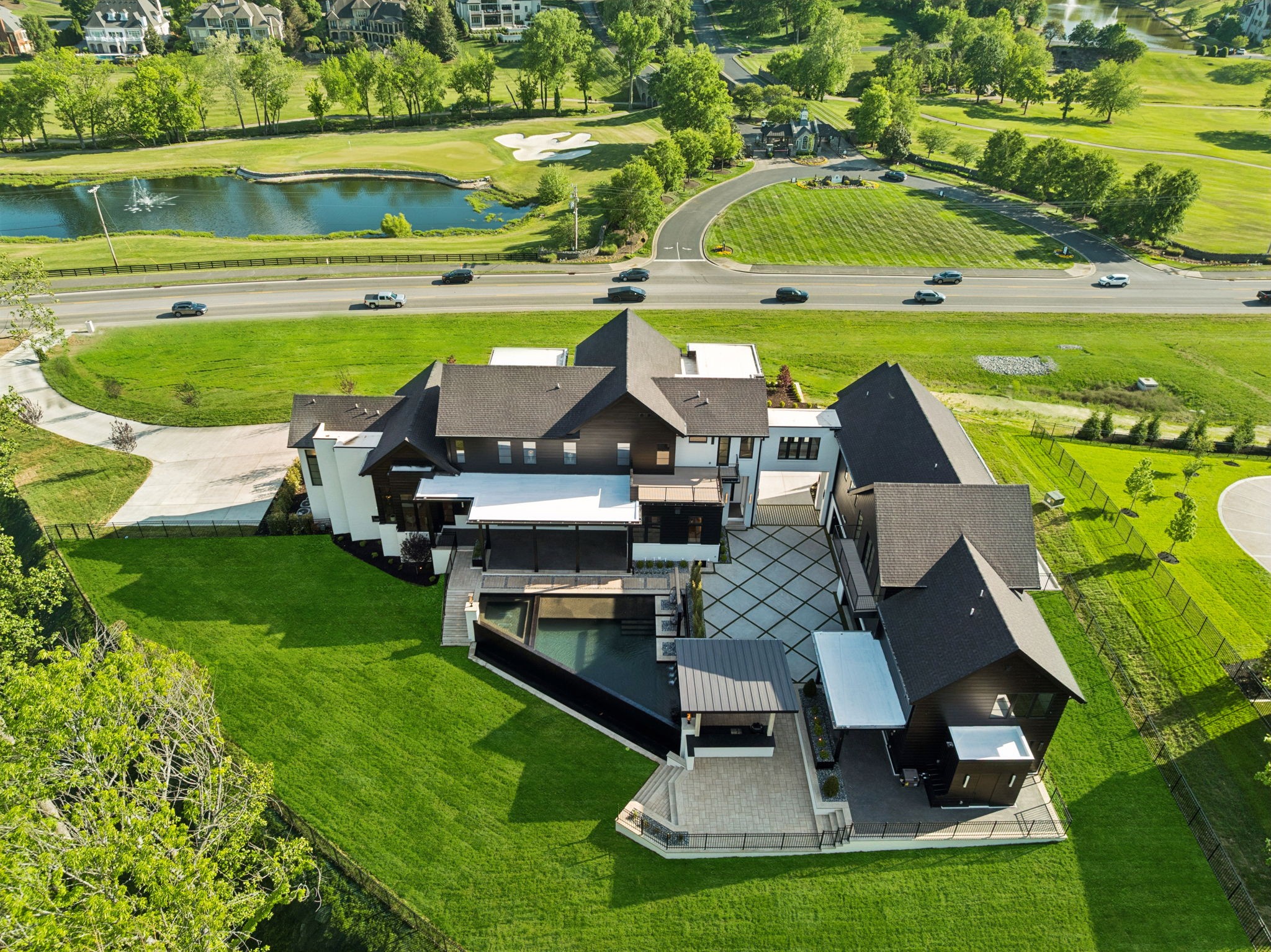 9636 Concord Road Brentwood, TN 37027 - Photo 99 of 99 an aerial view of a house with a garden and lake view
