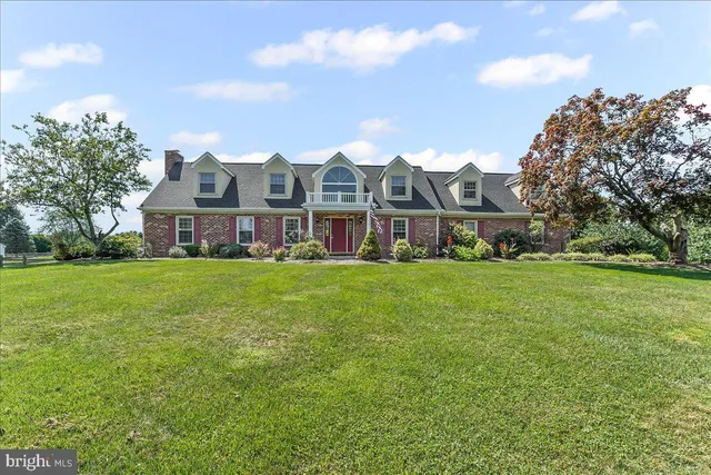 a front view of building with yard