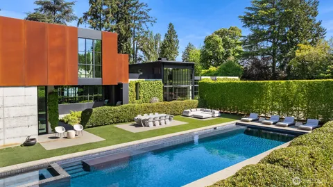 a view of a backyard with sitting area