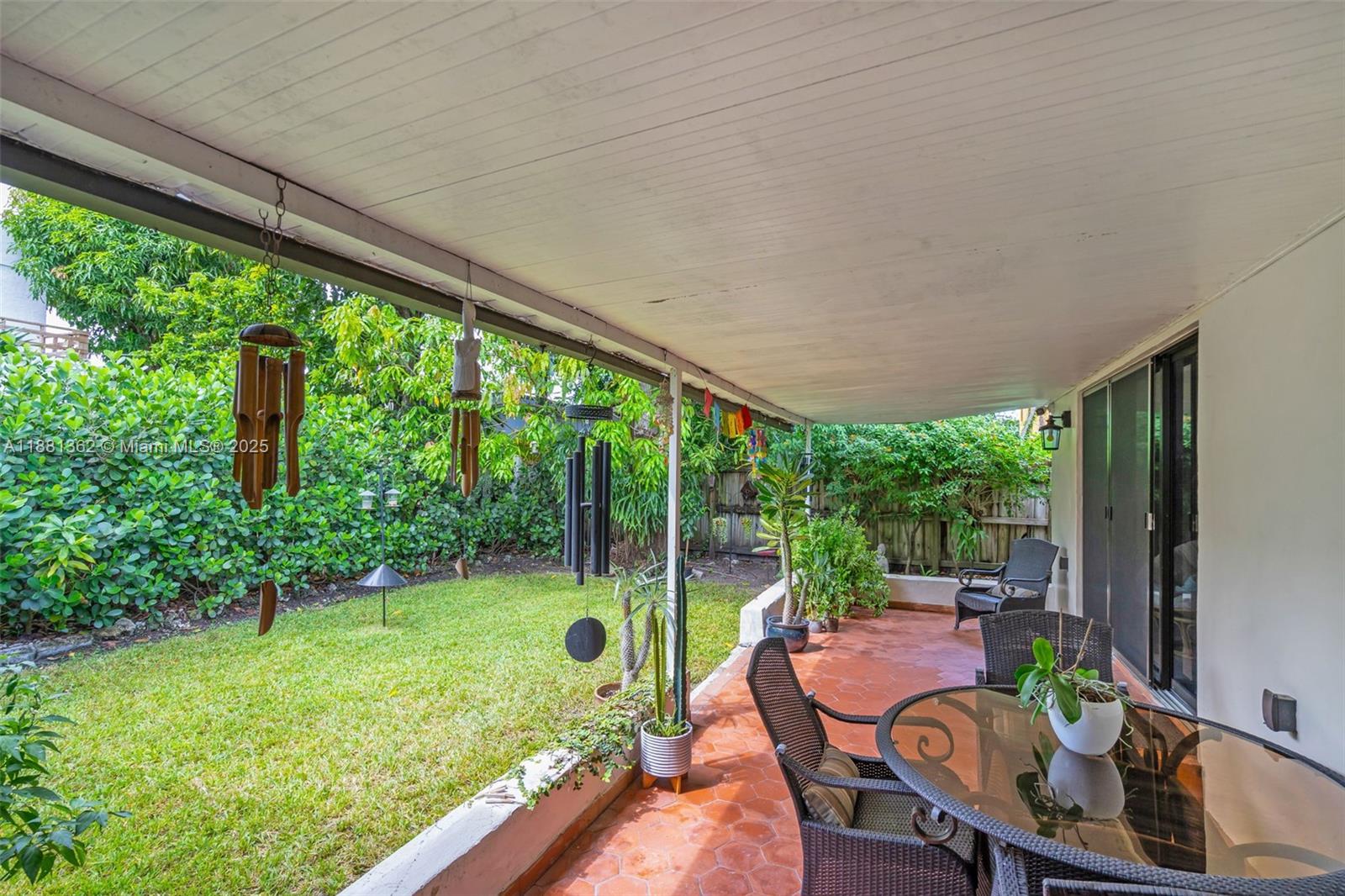 1642 Southwest 16th Street Miami, FL 33145 - Photo 21 of 28 a view of a chair and tables in the patio