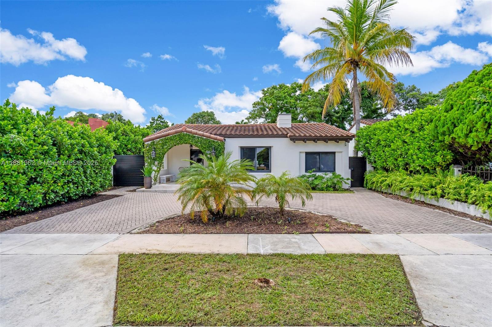 1642 Southwest 16th Street Miami, FL 33145 - Photo 26 of 28 a front view of a house with a garden