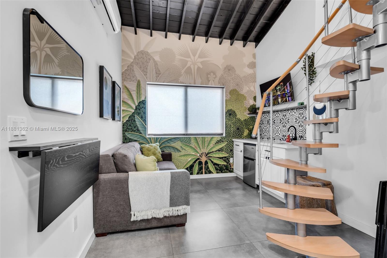 1642 Southwest 16th Street Miami, FL 33145 - Photo 3 of 28 a living room with furniture and a floor to ceiling window