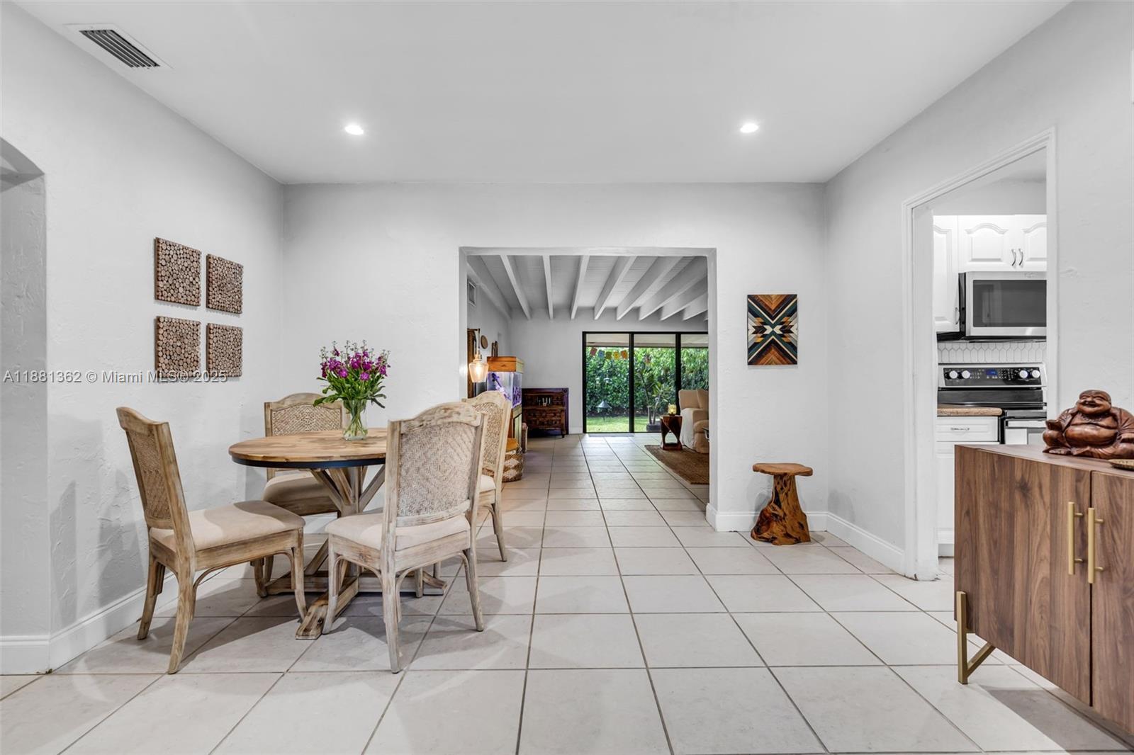 1642 Southwest 16th Street Miami, FL 33145 - Photo 6 of 28 a view of a dining room with furniture and chandelier