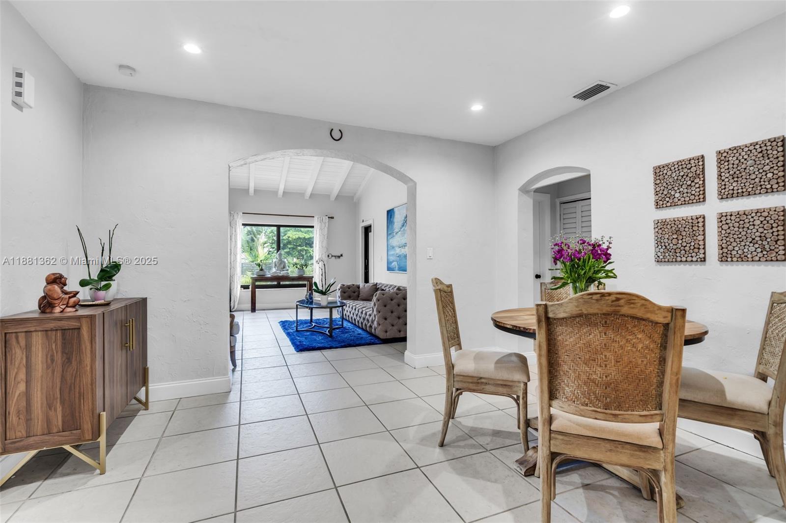 1642 Southwest 16th Street Miami, FL 33145 - Photo 7 of 28 a living room with furniture and a potted plant