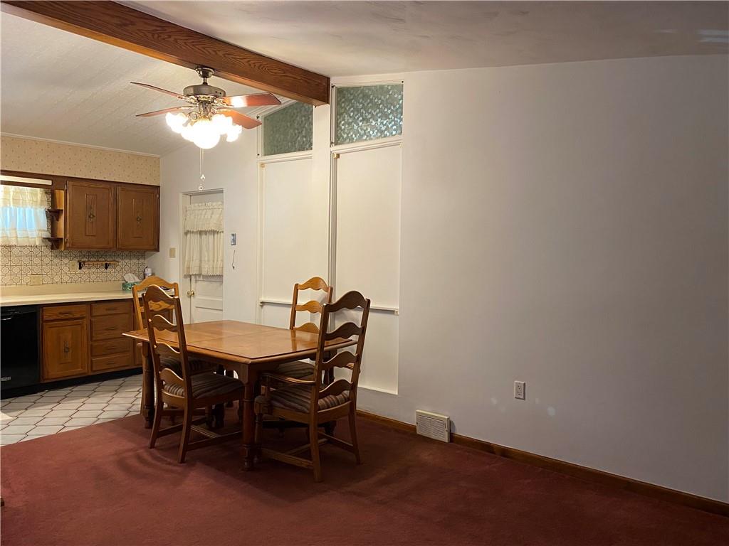 2647 Paige Street Lower Burrell, PA 15068 - Photo 6 of 13 a view of a dining room with furniture and a chandelier fan