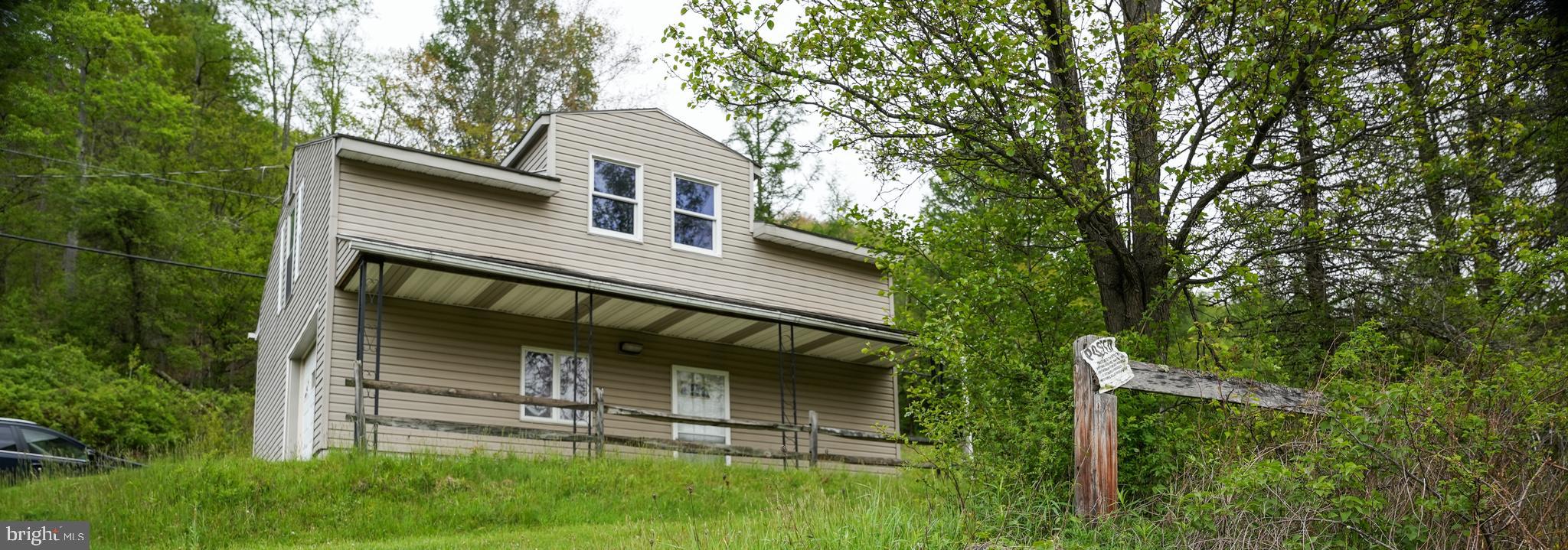 1315 1st Fork Road Austin, PA 16720 - Photo 22 of 25 a front view of house with a garden