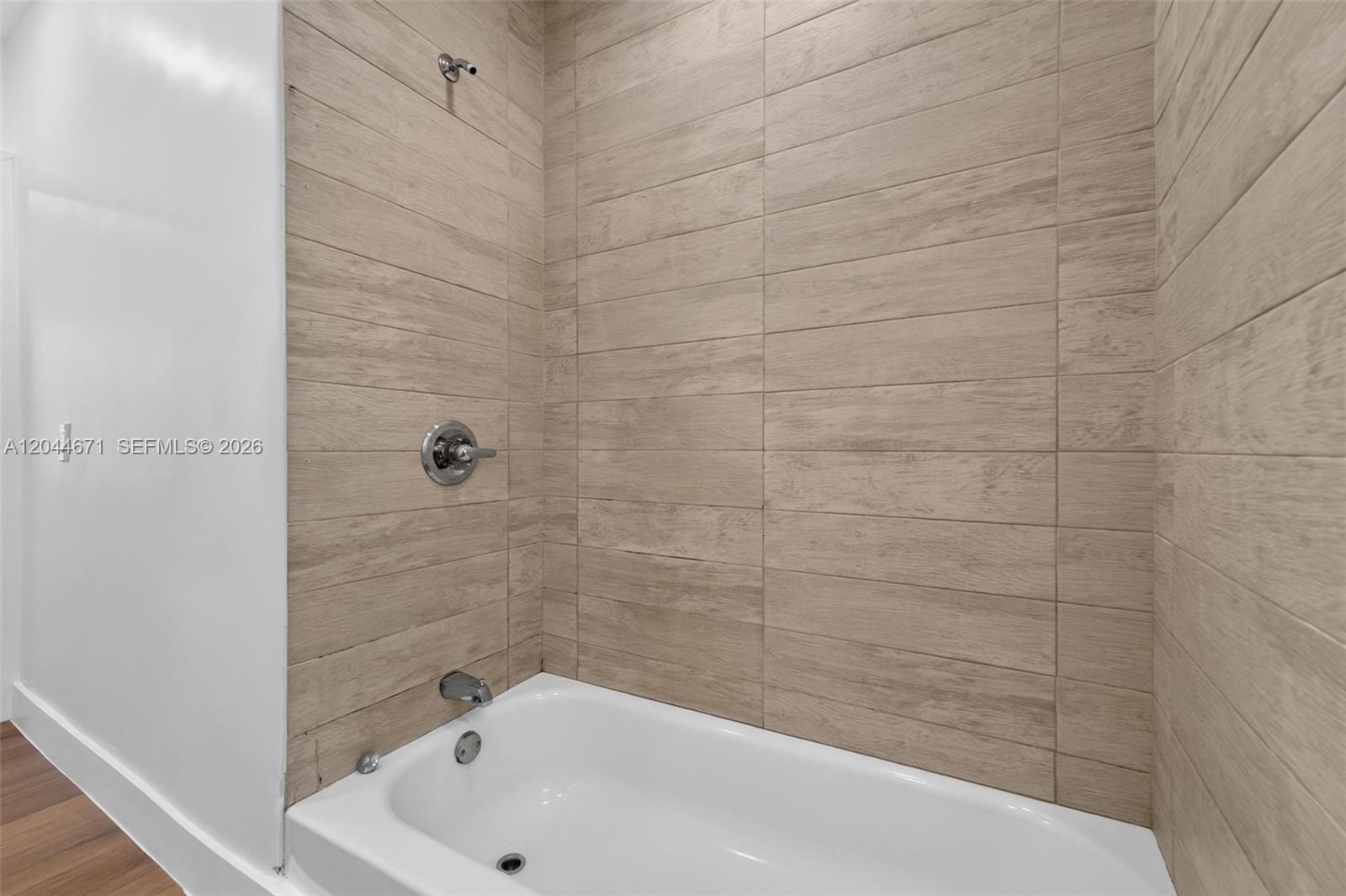 1900 Southwest 6th Street, Unit 6 Miami, FL 33135 - Photo 12 of 20 a bathroom with a bathtub