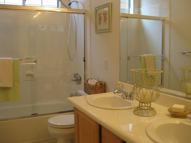 909 Sunbonnet Loop San Jose, CA 95125 - Photo 11 of 22 a bathroom with a granite countertop sink toilet and shower