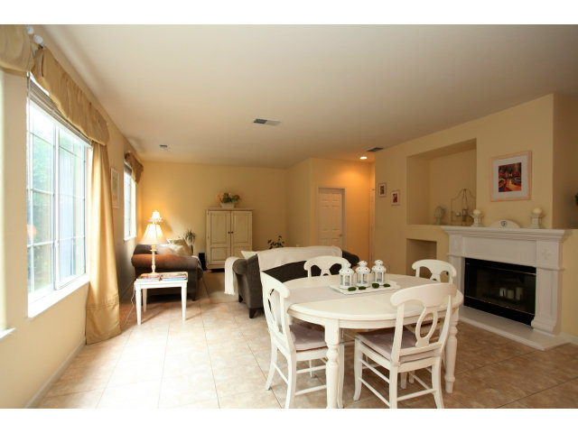 909 Sunbonnet Loop San Jose, CA 95125 - Photo 7 of 22 a dining room with furniture and a fireplace