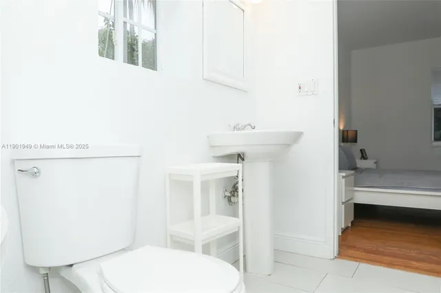 a bathroom with a sink and toilet
