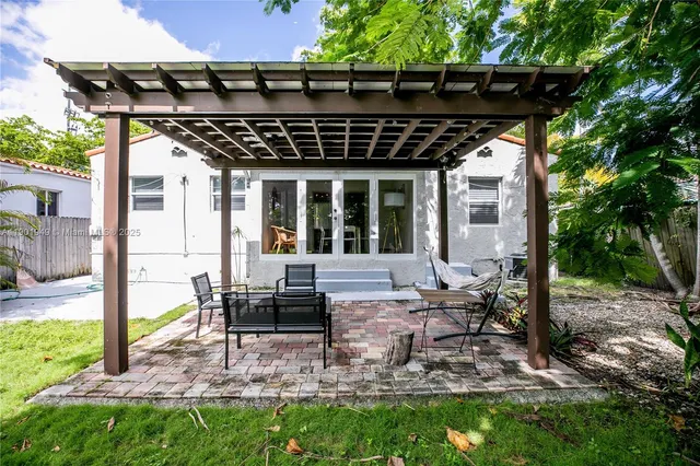 a view of a chairs and table in the garden