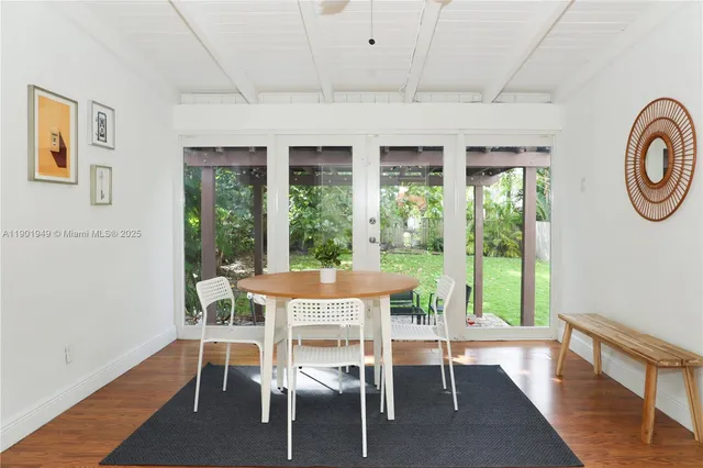a dining room with furniture a fireplace and a rug