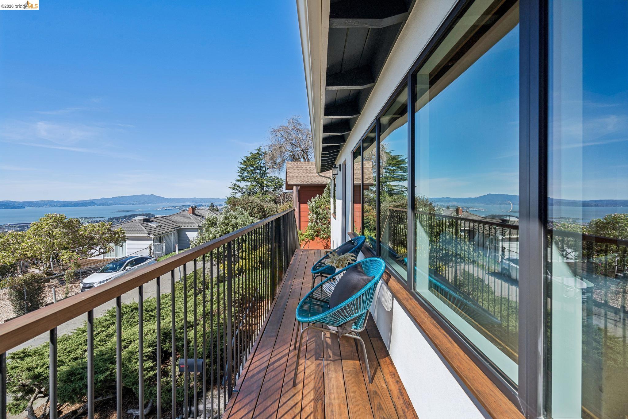 20 Stevenson Avenue Berkeley, CA 94708 - Photo 4 of 53 a view of a balcony with chairs and wooden floor