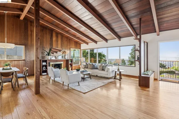 a living room with furniture rug and window