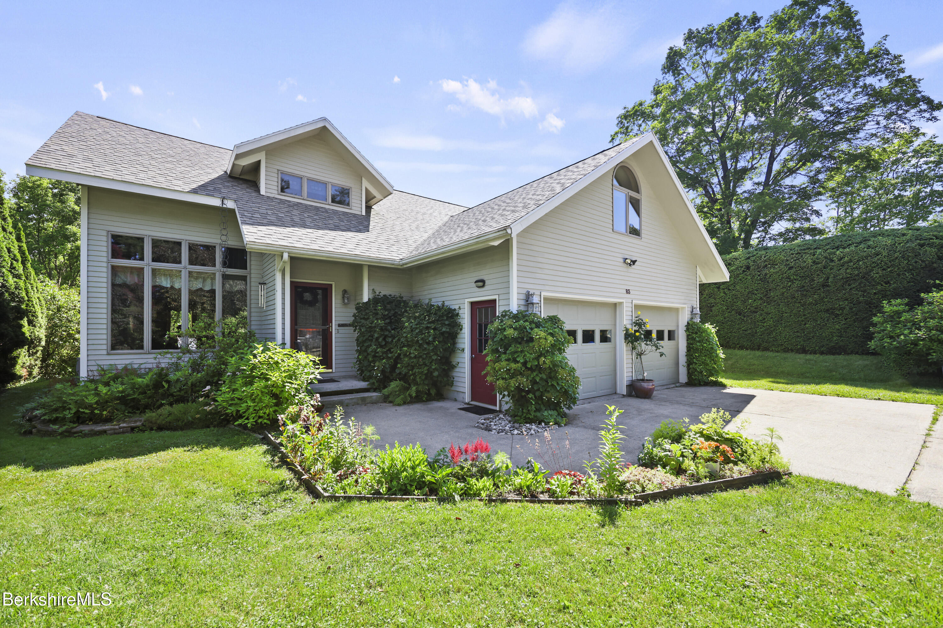 83 Hancock Road Pittsfield, MA 01201 - Photo 2 of 51 a front view of a house with a yard and potted plants