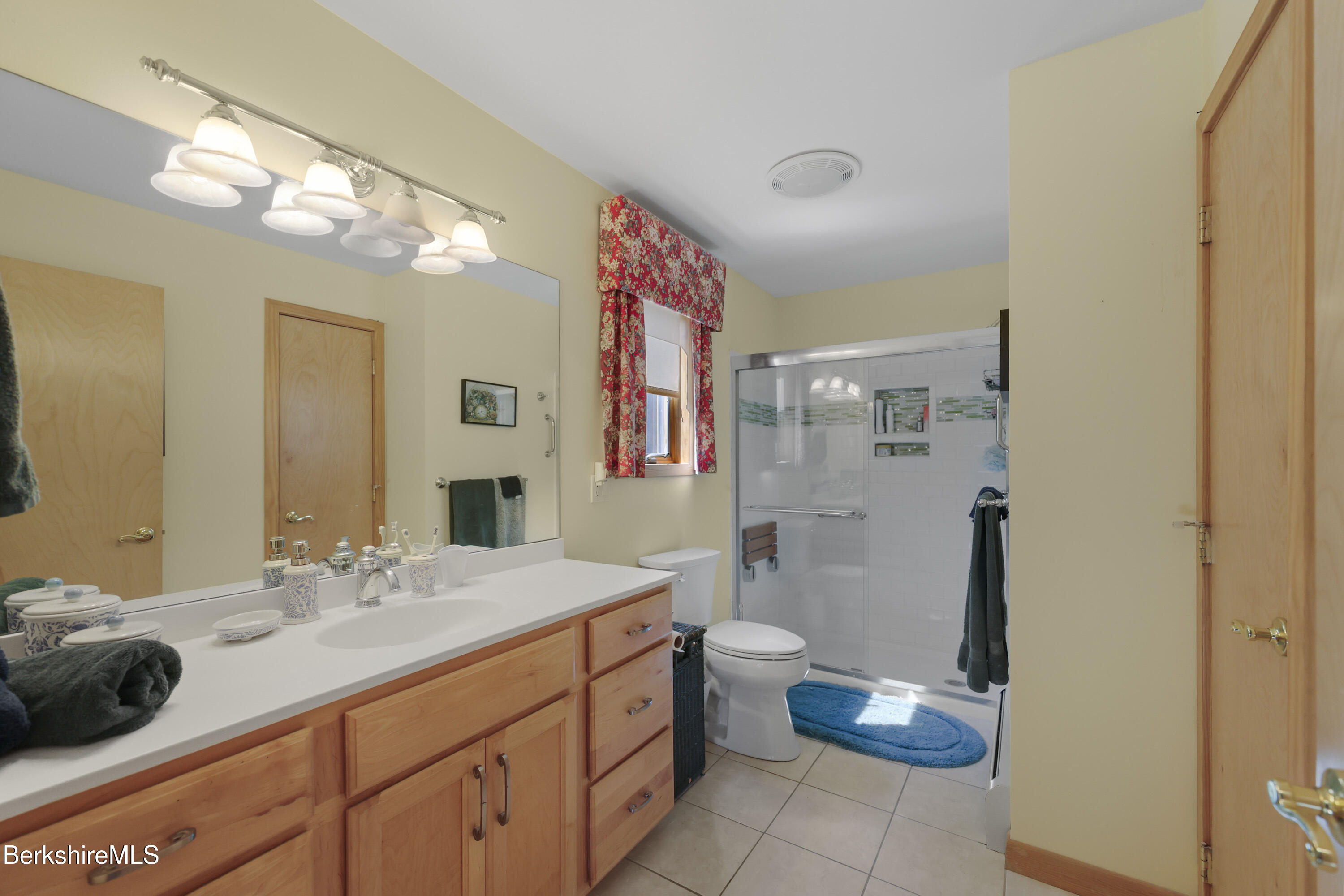 83 Hancock Road Pittsfield, MA 01201 - Photo 22 of 51 a bathroom with a sink a toilet and a mirror