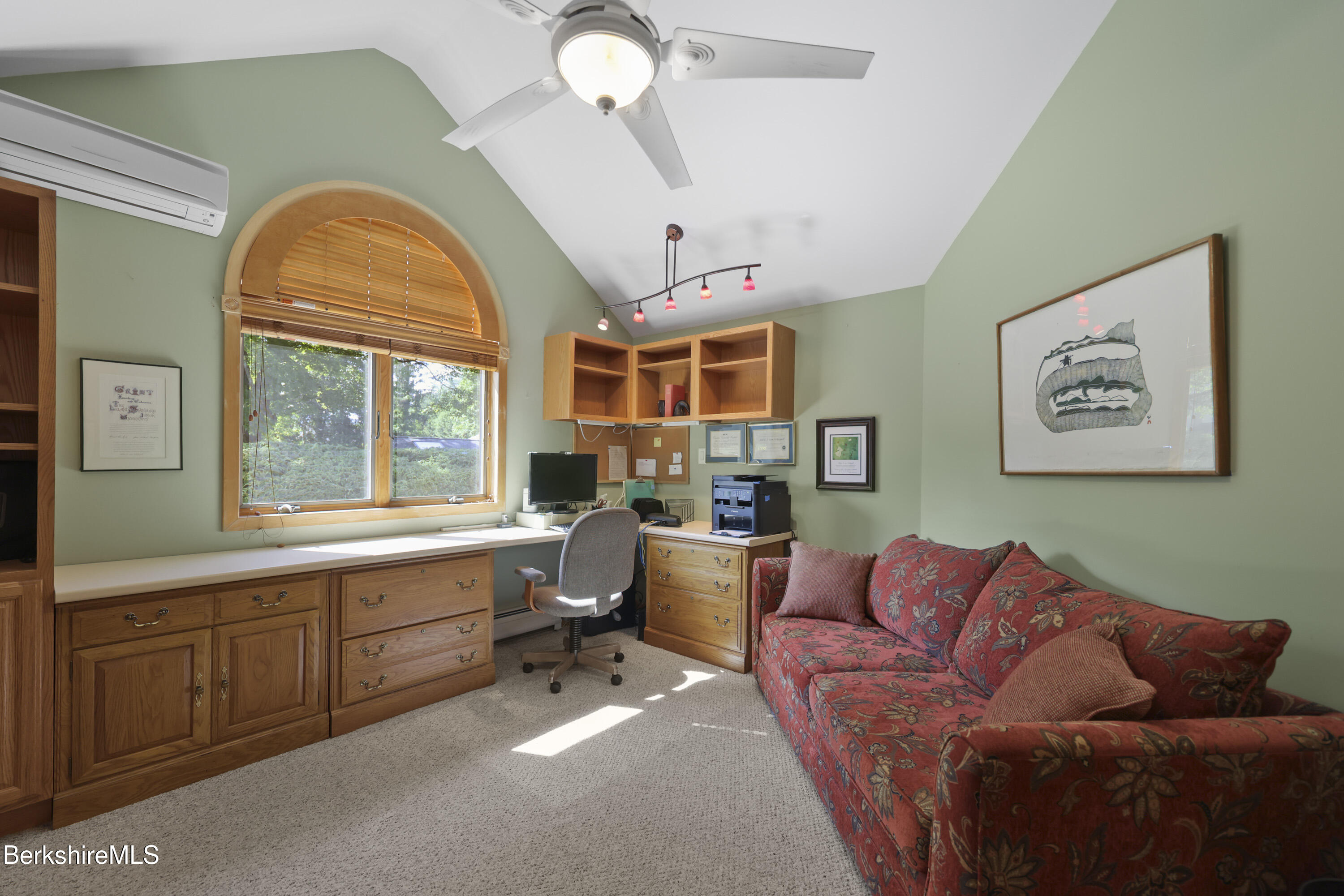 83 Hancock Road Pittsfield, MA 01201 - Photo 28 of 51 a living room with furniture a fireplace and a large window
