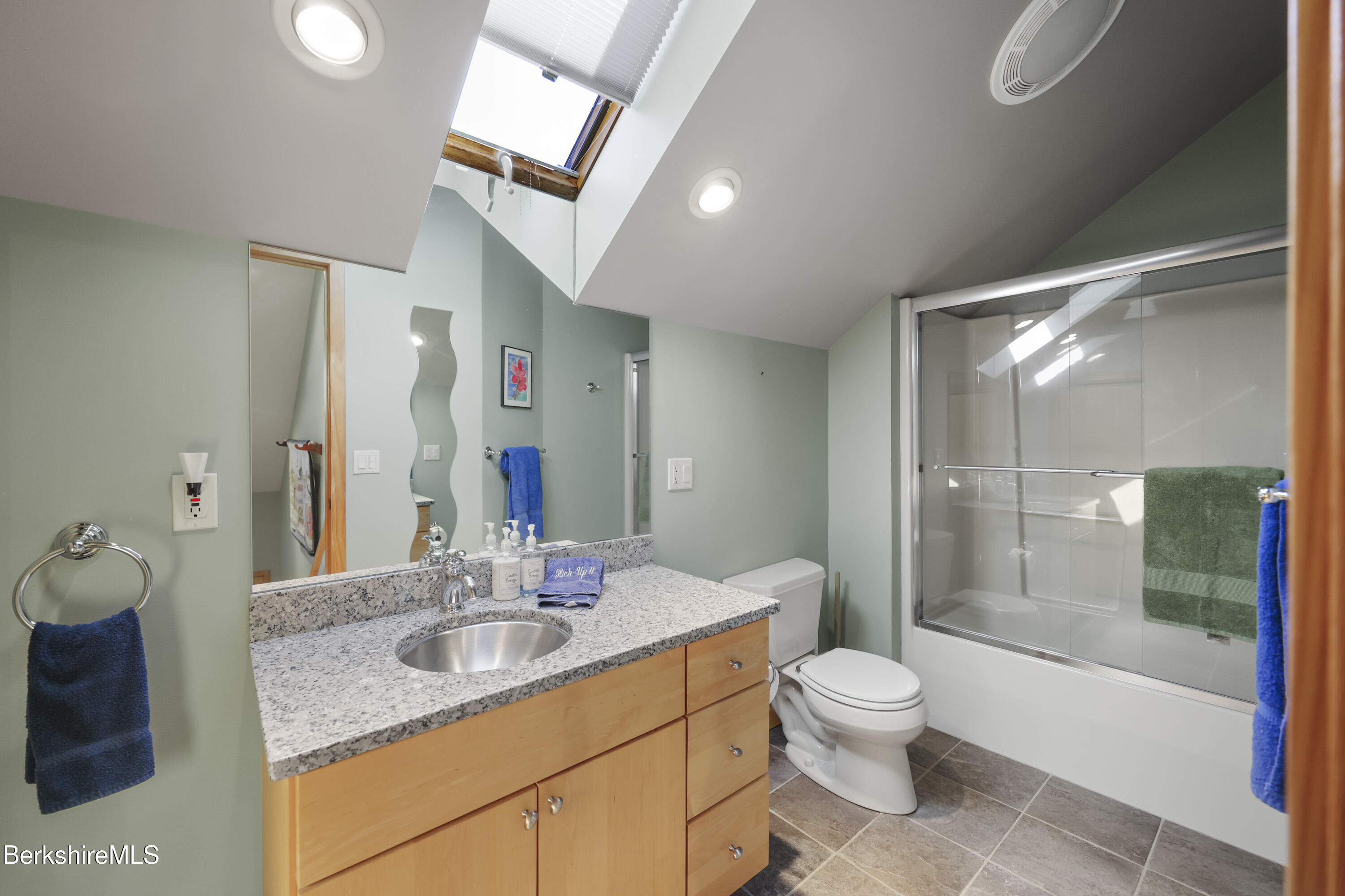 83 Hancock Road Pittsfield, MA 01201 - Photo 30 of 51 a bathroom with a granite countertop sink toilet a mirror and shower