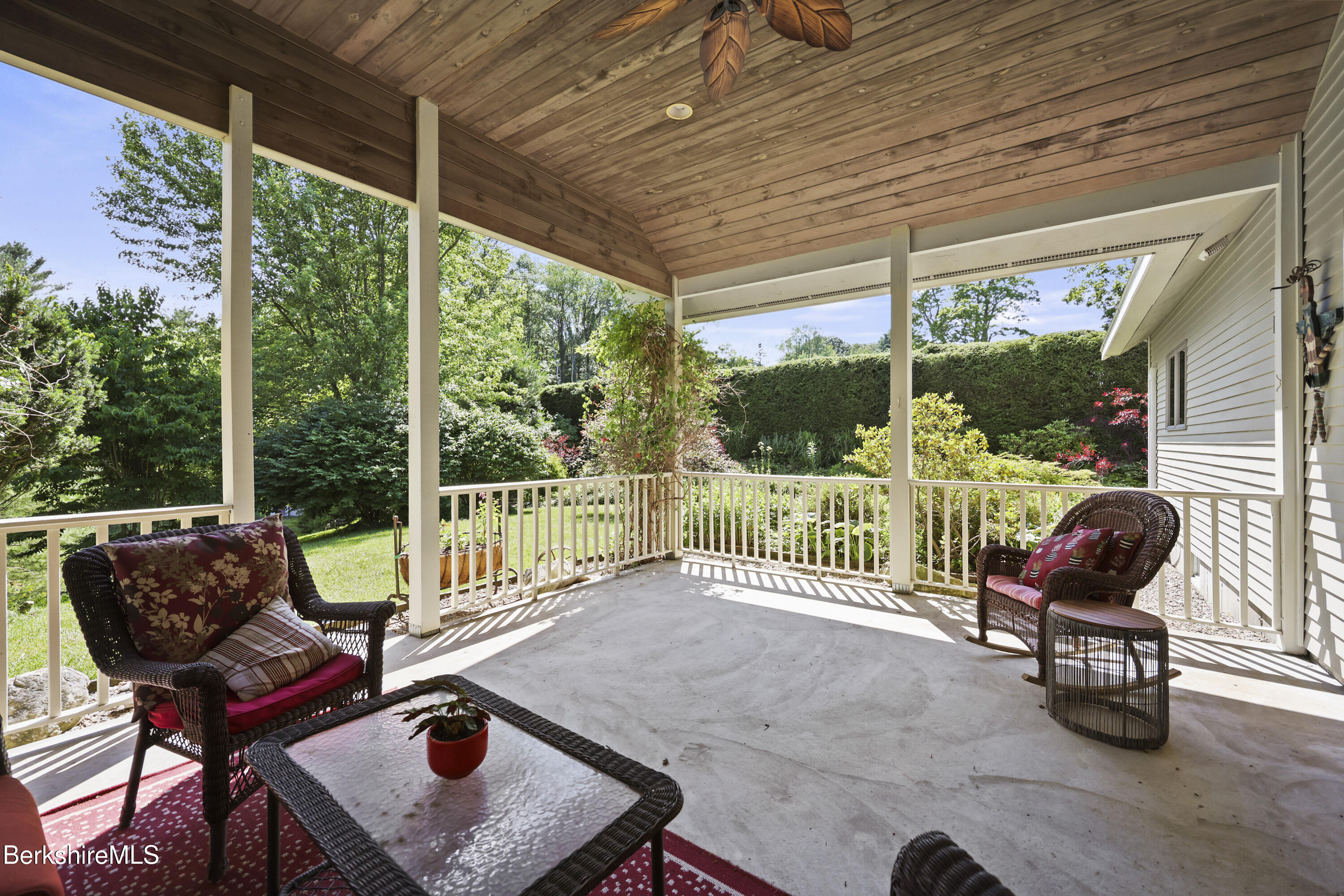 83 Hancock Road Pittsfield, MA 01201 - Photo 32 of 51 a view of a chairs and table in patio with a backyard
