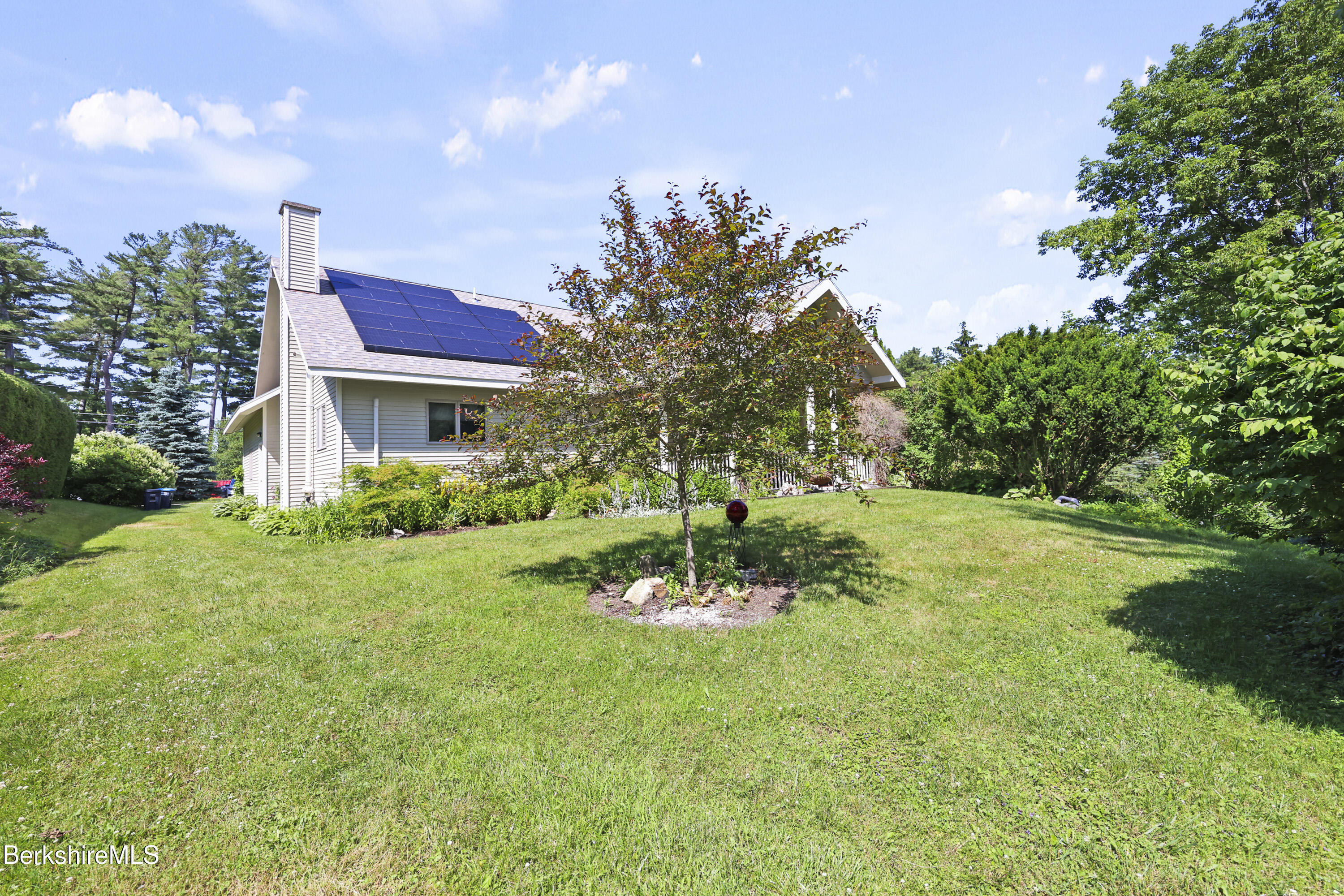 83 Hancock Road Pittsfield, MA 01201 - Photo 40 of 51 a view of a flower in a yard with a house