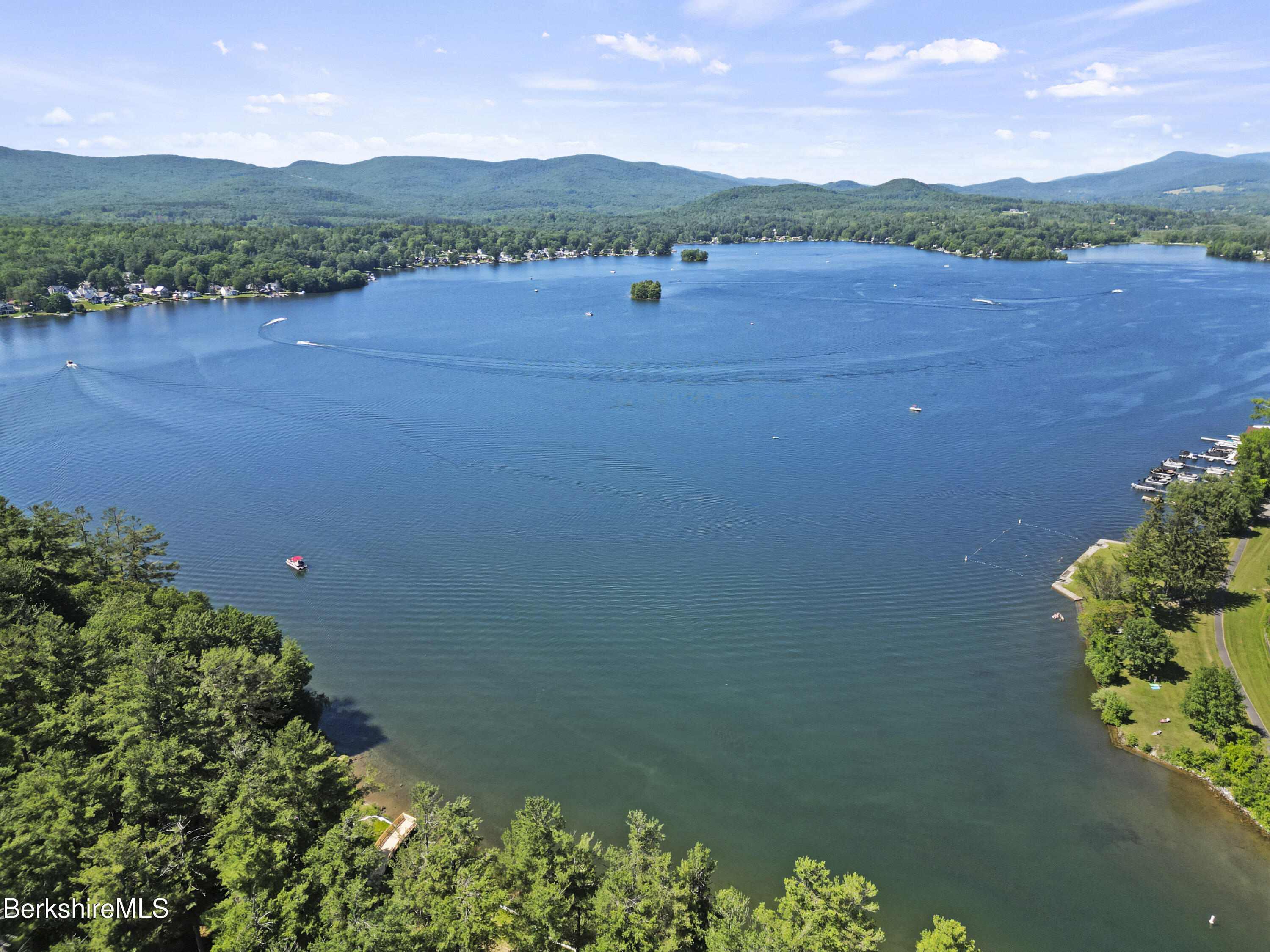 83 Hancock Road Pittsfield, MA 01201 - Photo 4 of 51 a view of a lake with a mountain in the background
