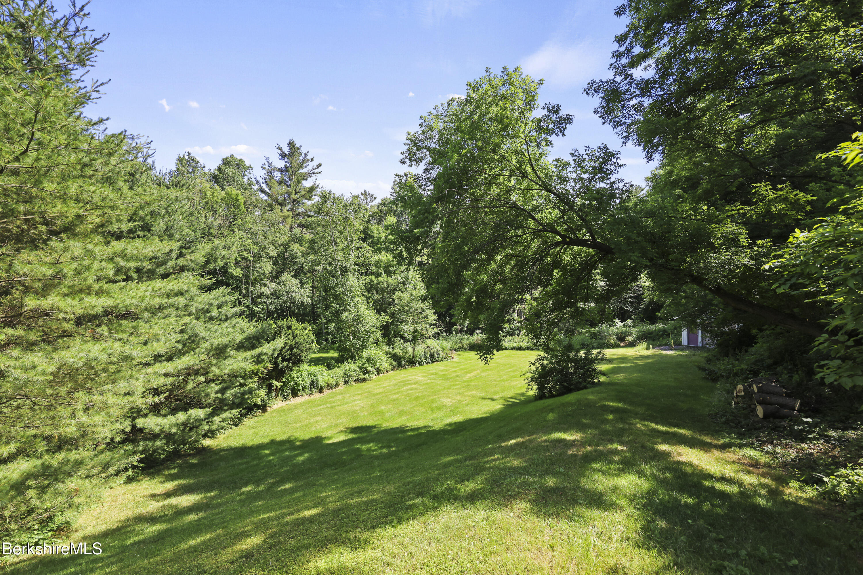 83 Hancock Road Pittsfield, MA 01201 - Photo 42 of 51 a backyard of a house with lots of green space