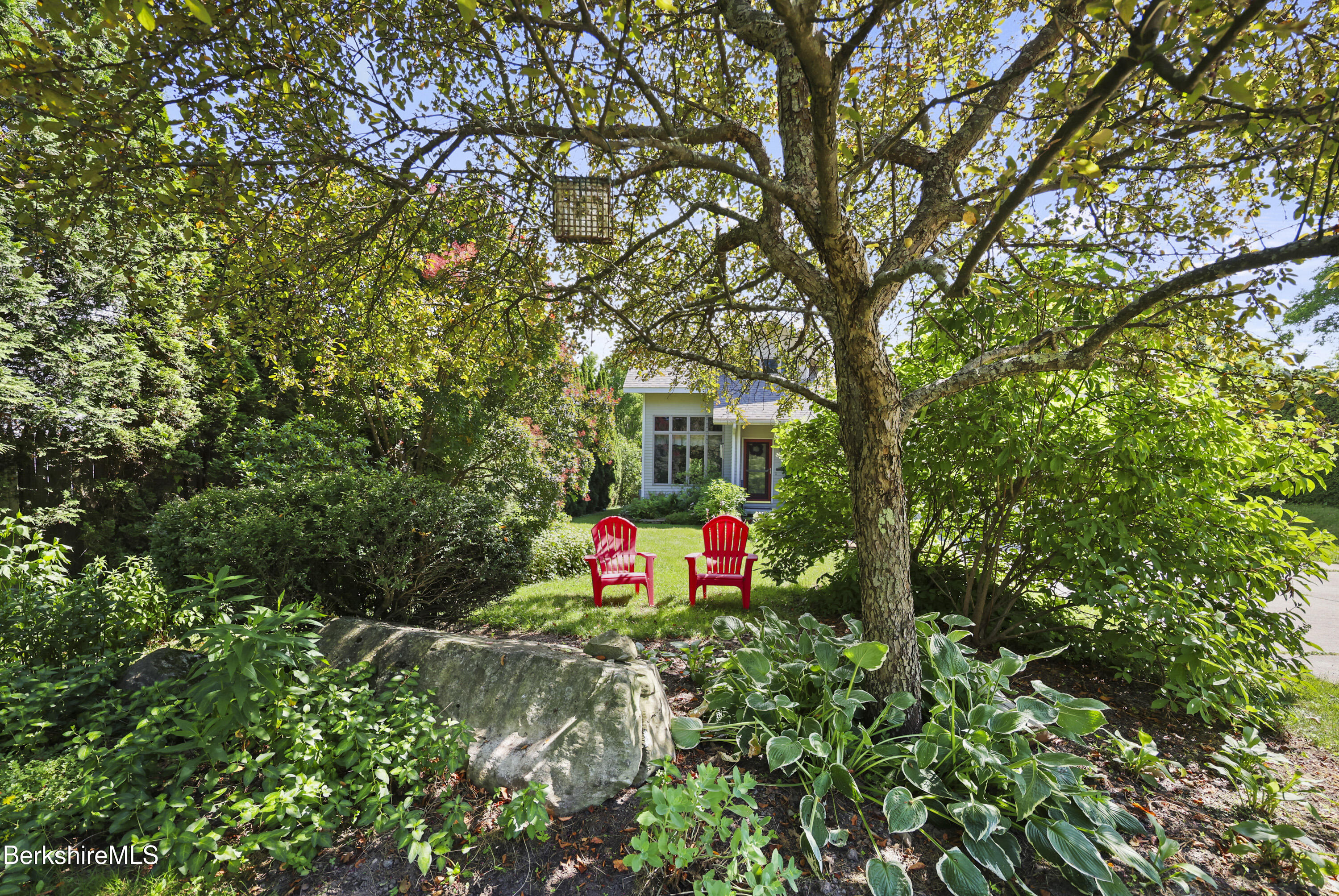 83 Hancock Road Pittsfield, MA 01201 - Photo 50 of 51 a backyard of a house with lots of green space and fountain