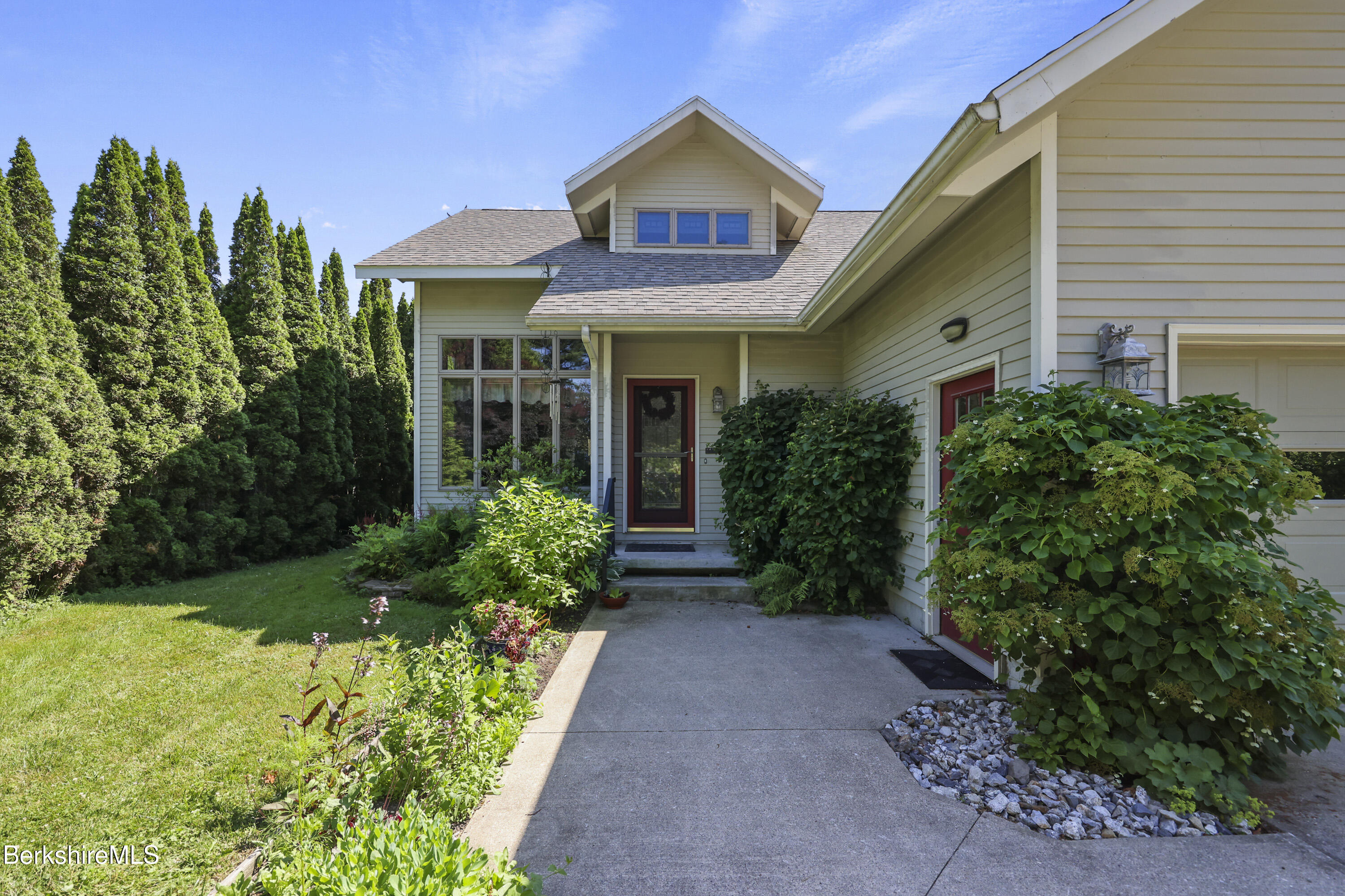 83 Hancock Road Pittsfield, MA 01201 - Photo 6 of 51 a view of a house with potted plants and a table and chairs