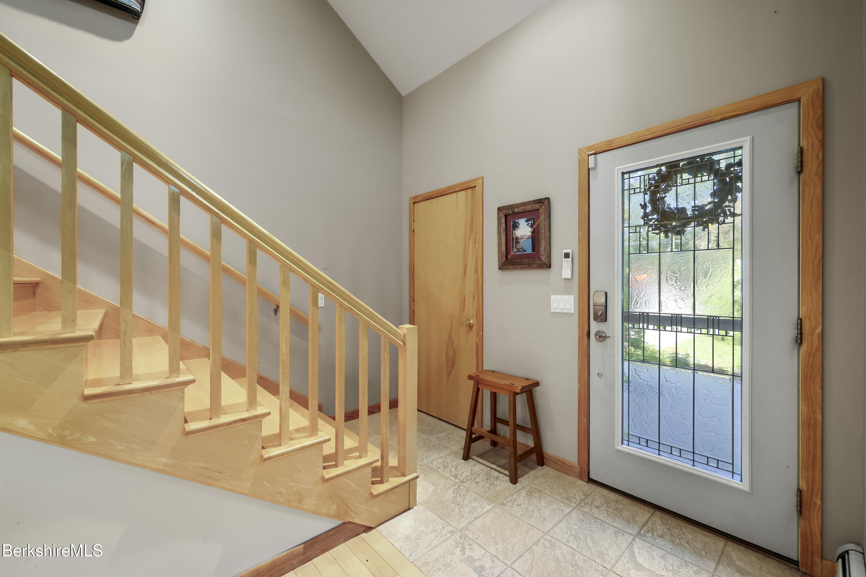 83 Hancock Road Pittsfield, MA 01201 - Photo 7 of 51 a view of an entryway with wooden floor and windows