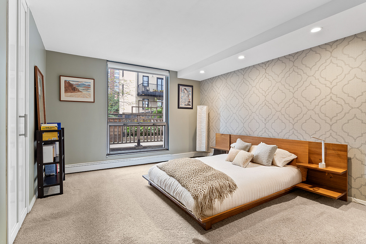 1310 North Ritchie Court, Unit 3A Chicago, IL 60610 - Photo 11 of 23 a bedroom with a large bed and a window