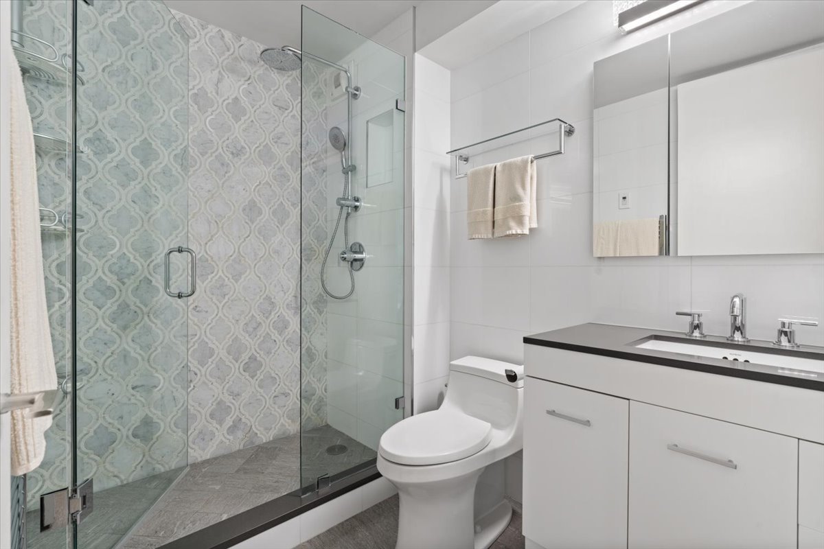 1310 North Ritchie Court, Unit 3A Chicago, IL 60610 - Photo 12 of 23 a bathroom with a sink toilet and shower