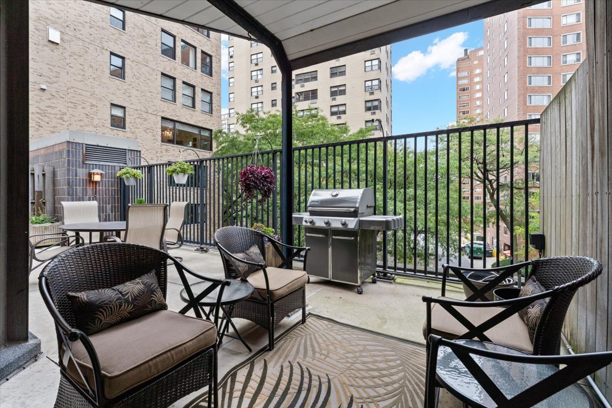 1310 North Ritchie Court, Unit 3A Chicago, IL 60610 - Photo 17 of 23 a balcony with furniture and a potted plant