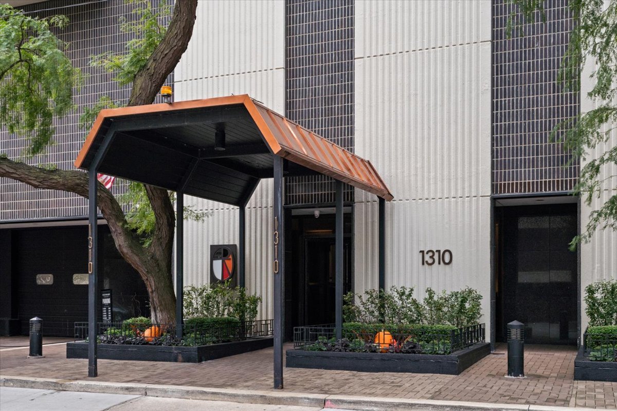 1310 North Ritchie Court, Unit 3A Chicago, IL 60610 - Photo 23 of 23 a view of a house with a small garden