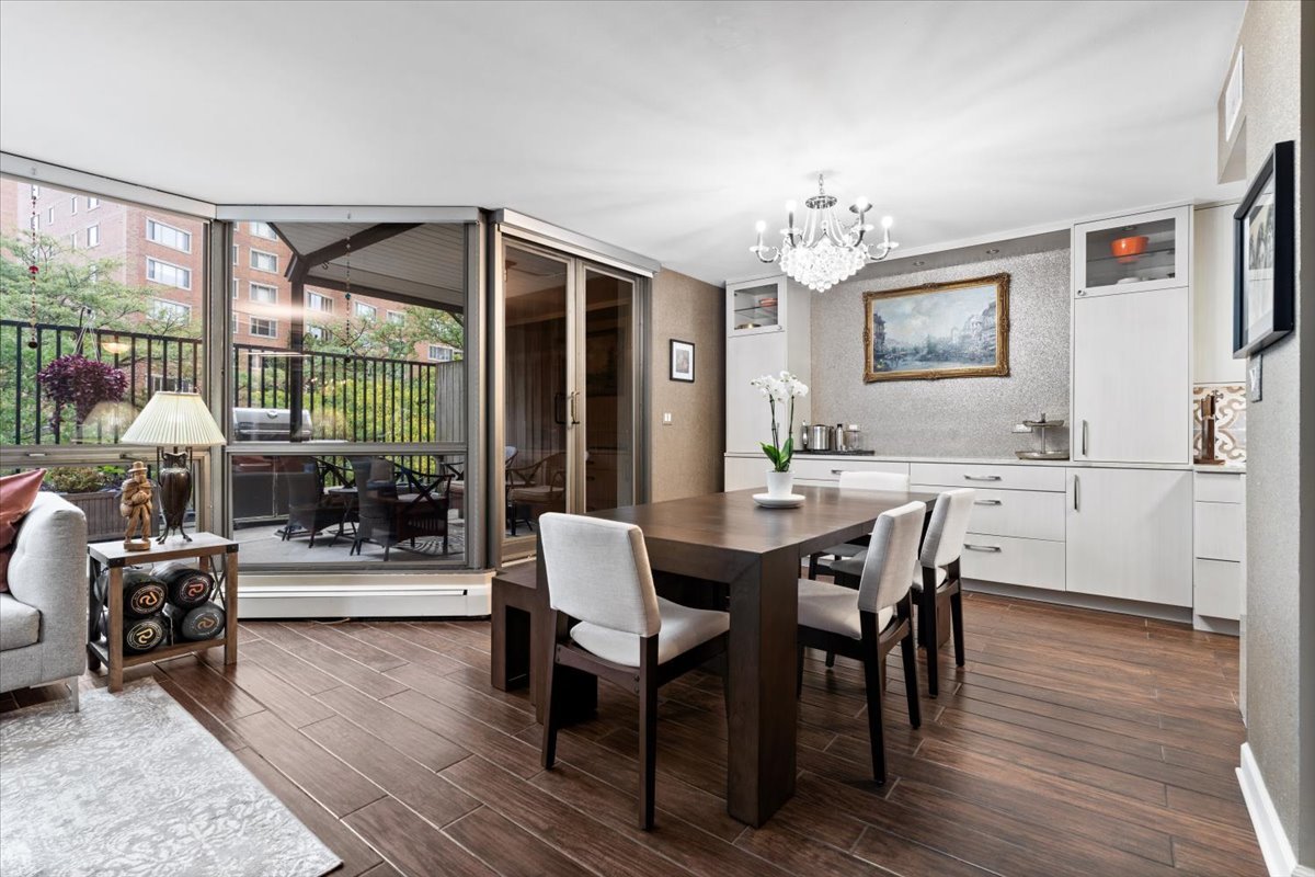 1310 North Ritchie Court, Unit 3A Chicago, IL 60610 - Photo 9 of 23 a view of a dining room with furniture window and wooden floor
