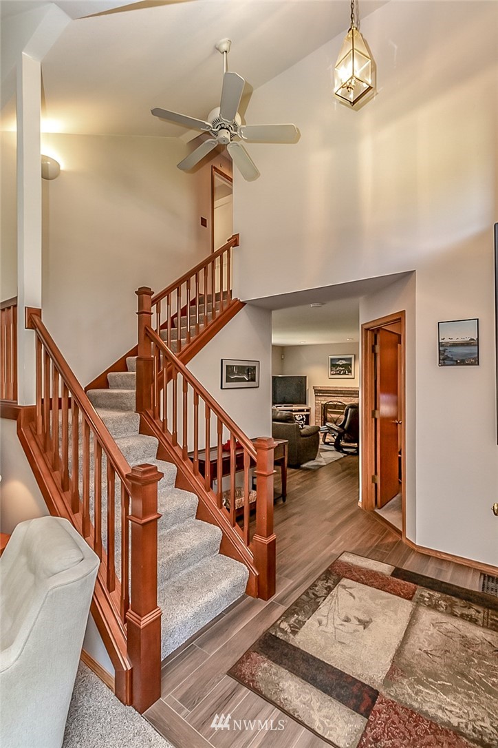 3126 210th Street Southeast Bothell, WA 98021 - Photo 2 of 33 a view of entryway and hall with dining room