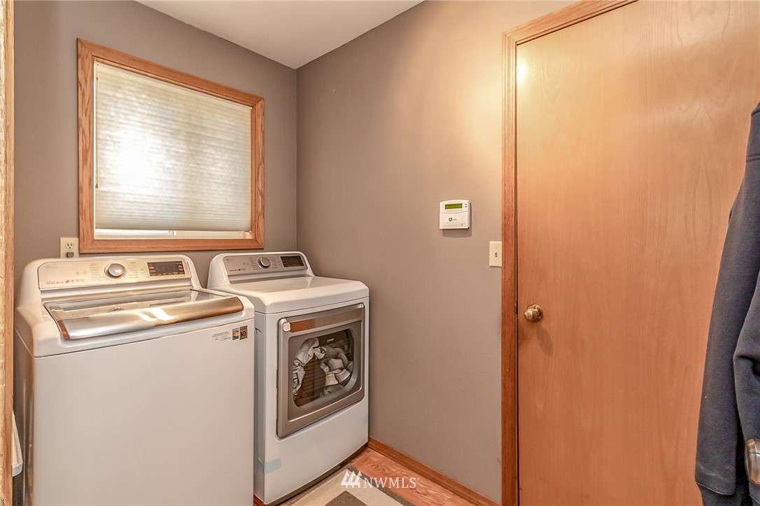 3126 210th Street Southeast Bothell, WA 98021 - Photo 13 of 33 a view of storage and utility room with washer and dryer