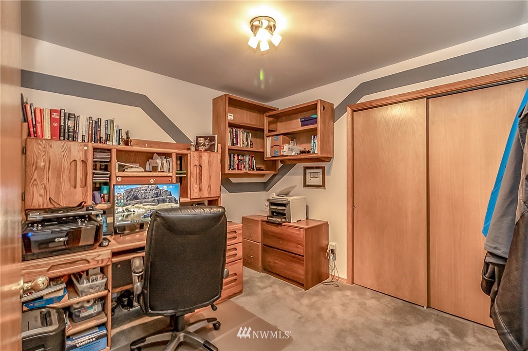 3126 210th Street Southeast Bothell, WA 98021 - Photo 14 of 33 a work room with furniture and a window