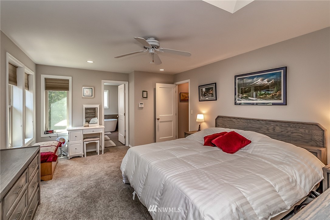 3126 210th Street Southeast Bothell, WA 98021 - Photo 17 of 33 a bedroom with a bed and wooden floor